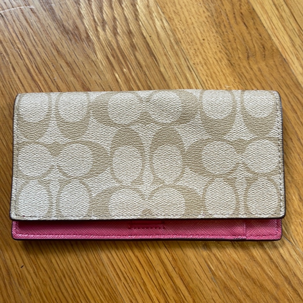 Coach checkbook case. Good condition. Minor mark near logo.